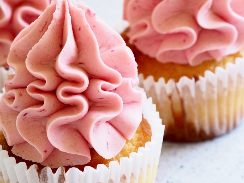 close-up picture of a cupcake with pink frosting