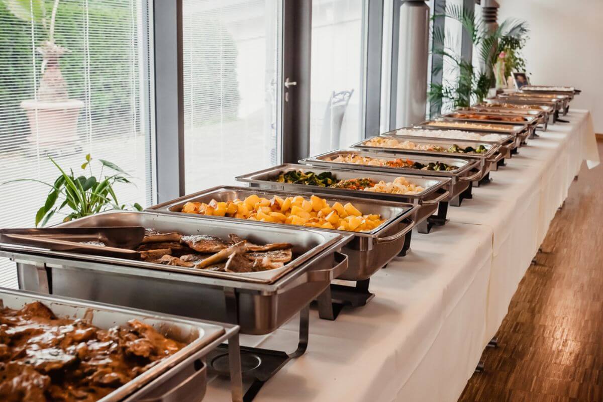 Buffet-style setup with assorted dishes for corporate guests