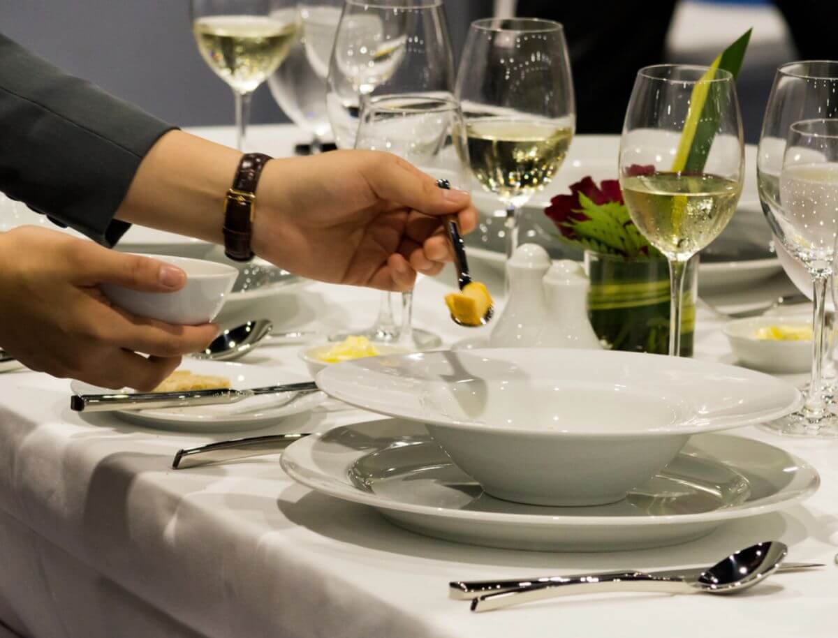 Professional catering team ensuring smooth service during a corporate dinner.