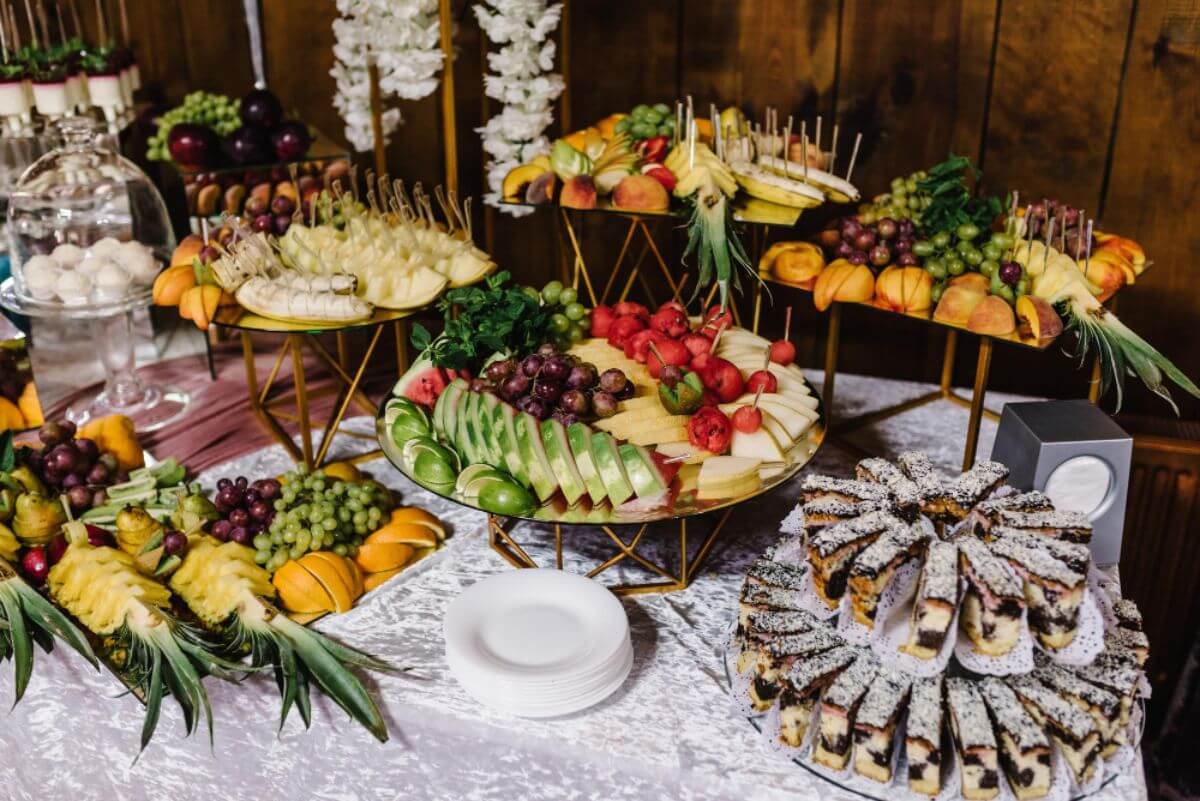 Selection of snacks, finger foods, and desserts suitable for corporate catering and evening receptions