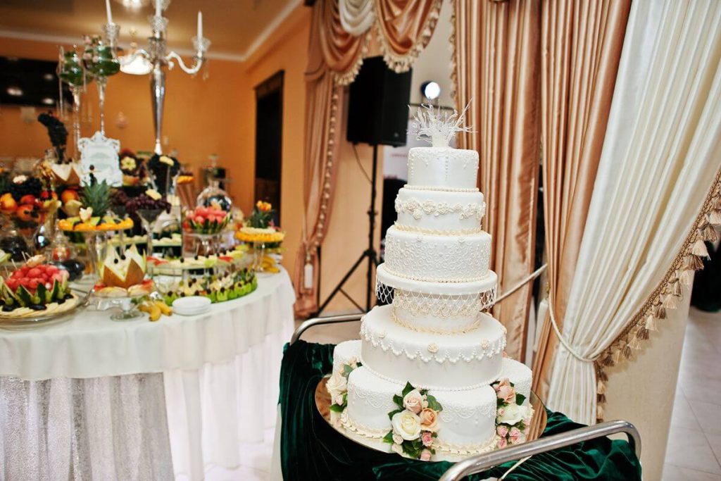 Wedding cake and catered food display for a reception menu and styling consultation