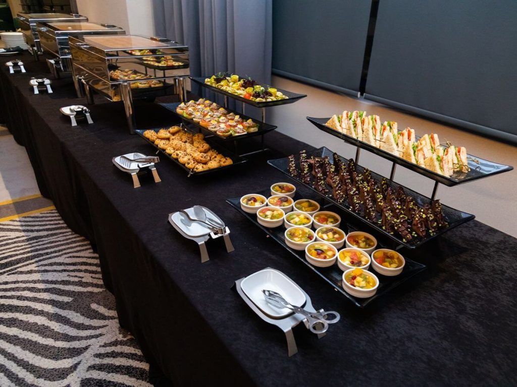 Refined buffet display with appetizers and plated selections for a wedding dining experience